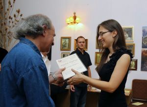 Karolina Bogusz receives diploma; Music and Literature Club 30. Aug 2012.